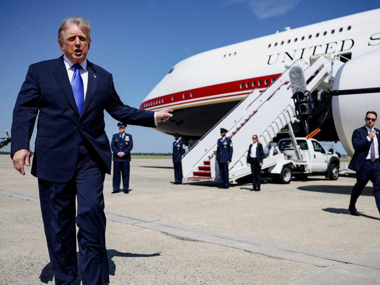 US President Donald Trump speaks to reporters before boarding Air Force One. Photo: Reuters