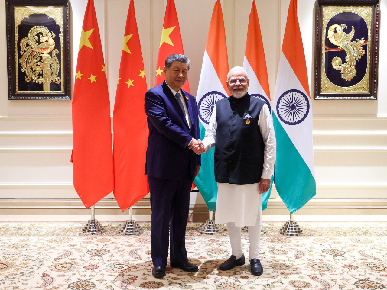 During bilateral talks, Xi Jinping and Narendra Modi agreed that China and India should be partners. Photo: Reuters