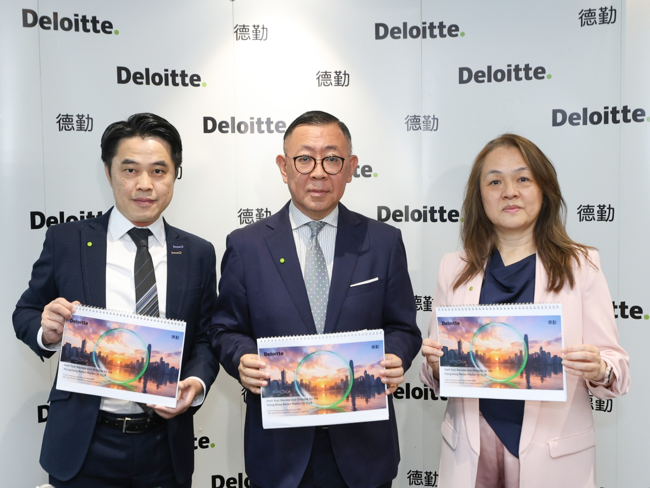 Michael Cheng, centre, Deloitte China's Hong Kong consumer market business leader, says the city's retail sales growth could slow down in the coming months. Photo courtesy of Deloitte China