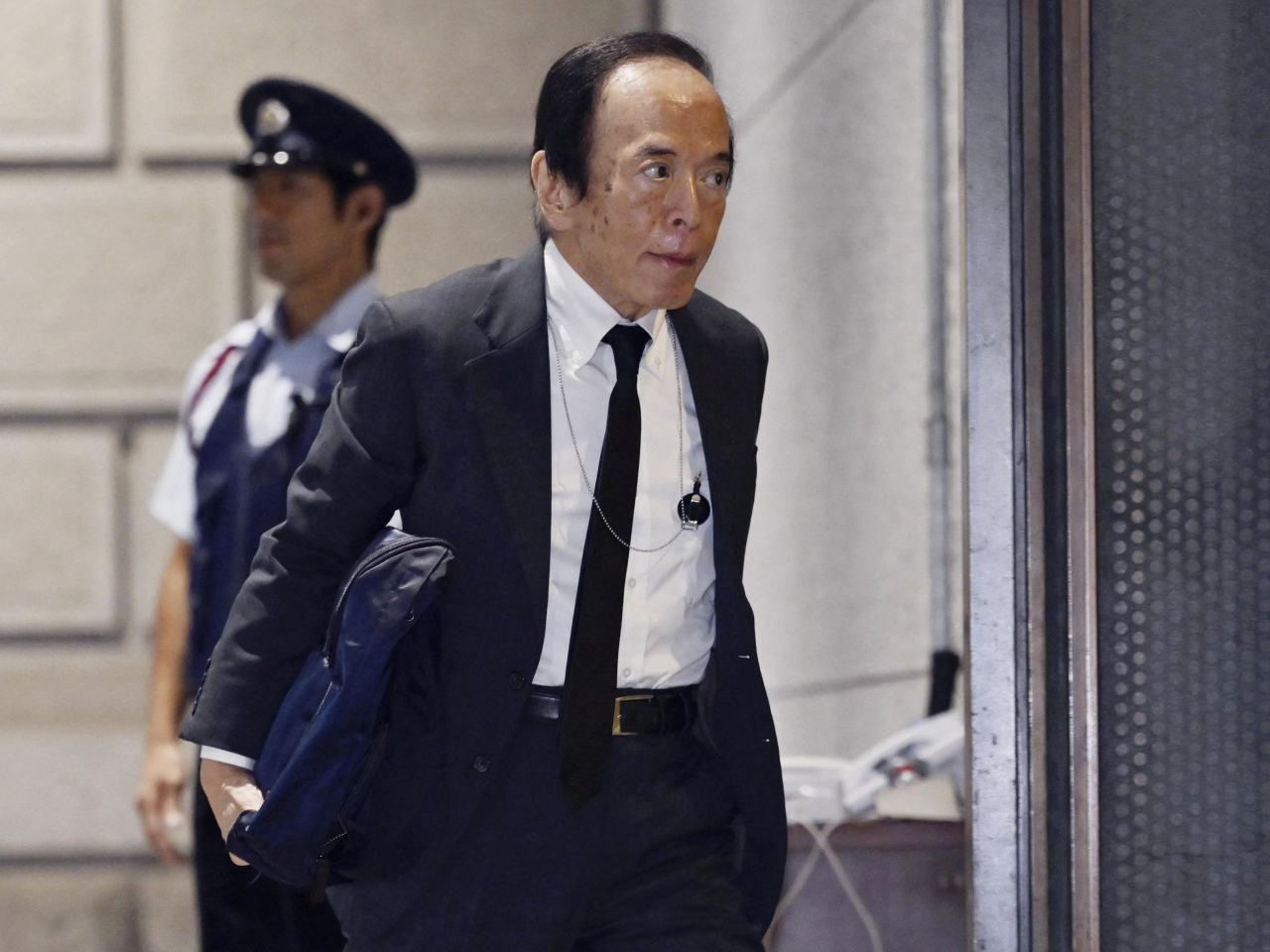 Governor Kazuo Ueda arrives at Bank of Japan's   headquarters for its policy-setting meeting. Photo: Kyodo via Reuters