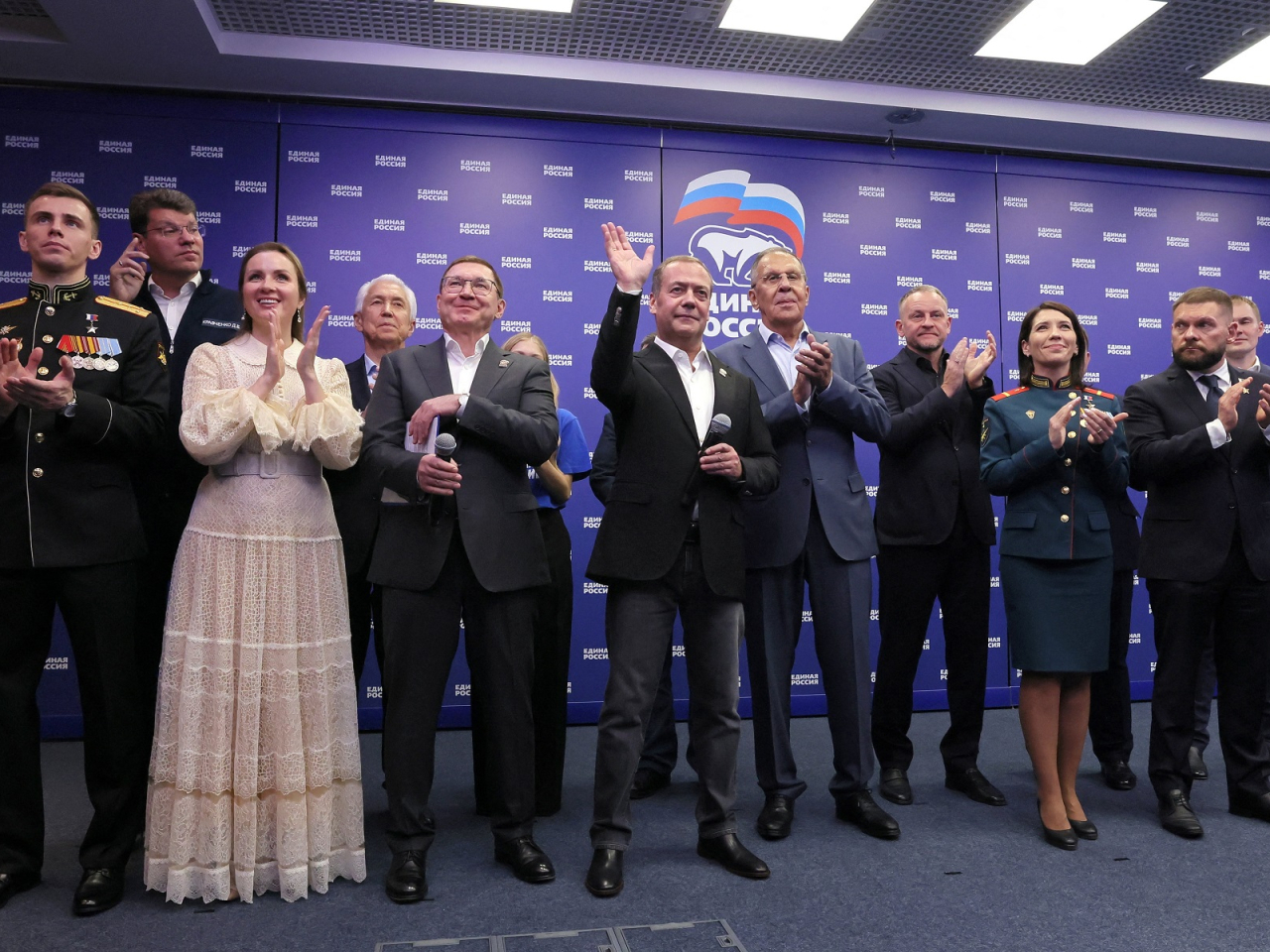 Senior members of Russia's ruling United Russia party visit the party's headquarters as an exit poll showed it was comfortably leading parliamentary elections. Photo: Reuters