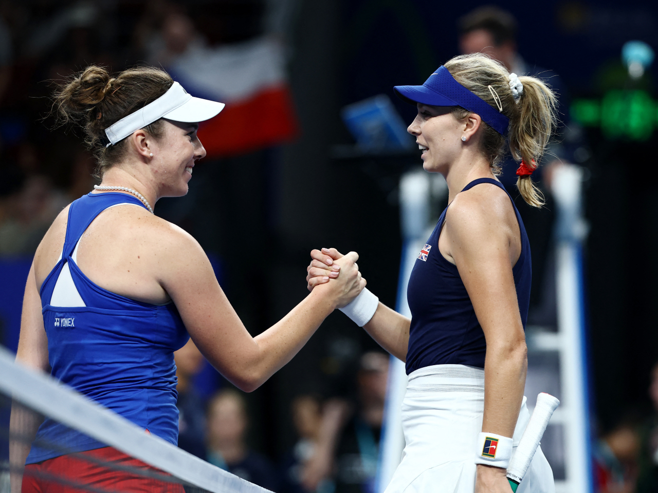 Linda Noskova, left, beat Great Britain's top-ranked Katie Boulter to send the Czechs into the semis. Photo: Reuters