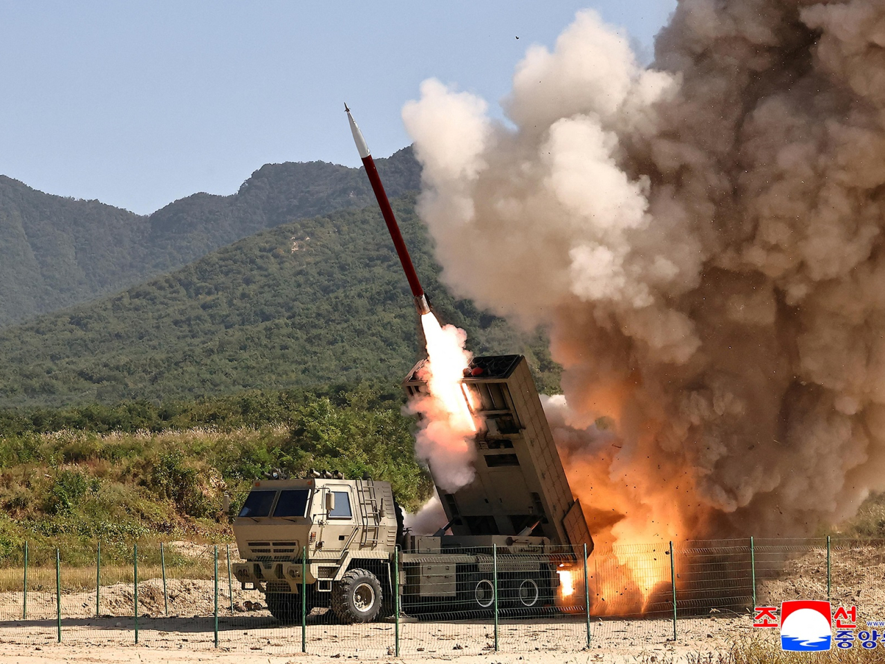 The test firing of an upgraded 240mm guided multiple rocket launcher system was conducted at an undisclosed location. Photo: KCNA via Reuters