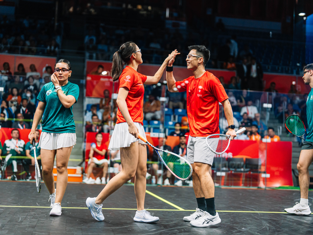 Toby Tse and Matthew Lai celebrate during their match against Pakistan. Photo courtesy of World Squash