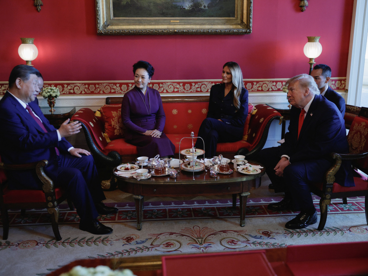 President Xi Jinping and first lady Peng Liyuan participate in tea with Donald and Melania Trump in the Red Room of the White House on Friday. File photo: Reuters