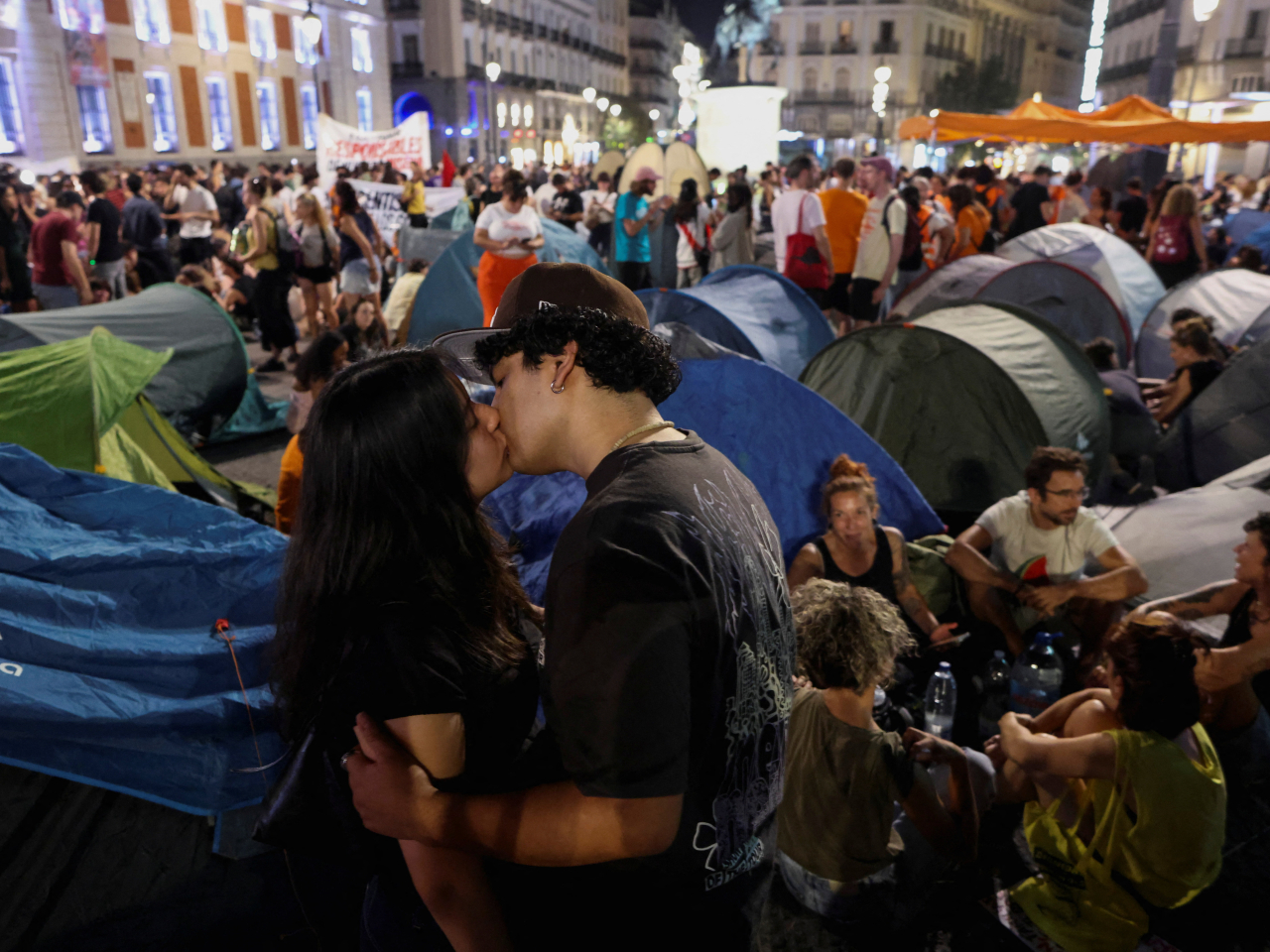 A couple share a kiss in a protest camp at Puerta del Sol square after a demonstration against Spain's housing crisis. Photo: Reuters
