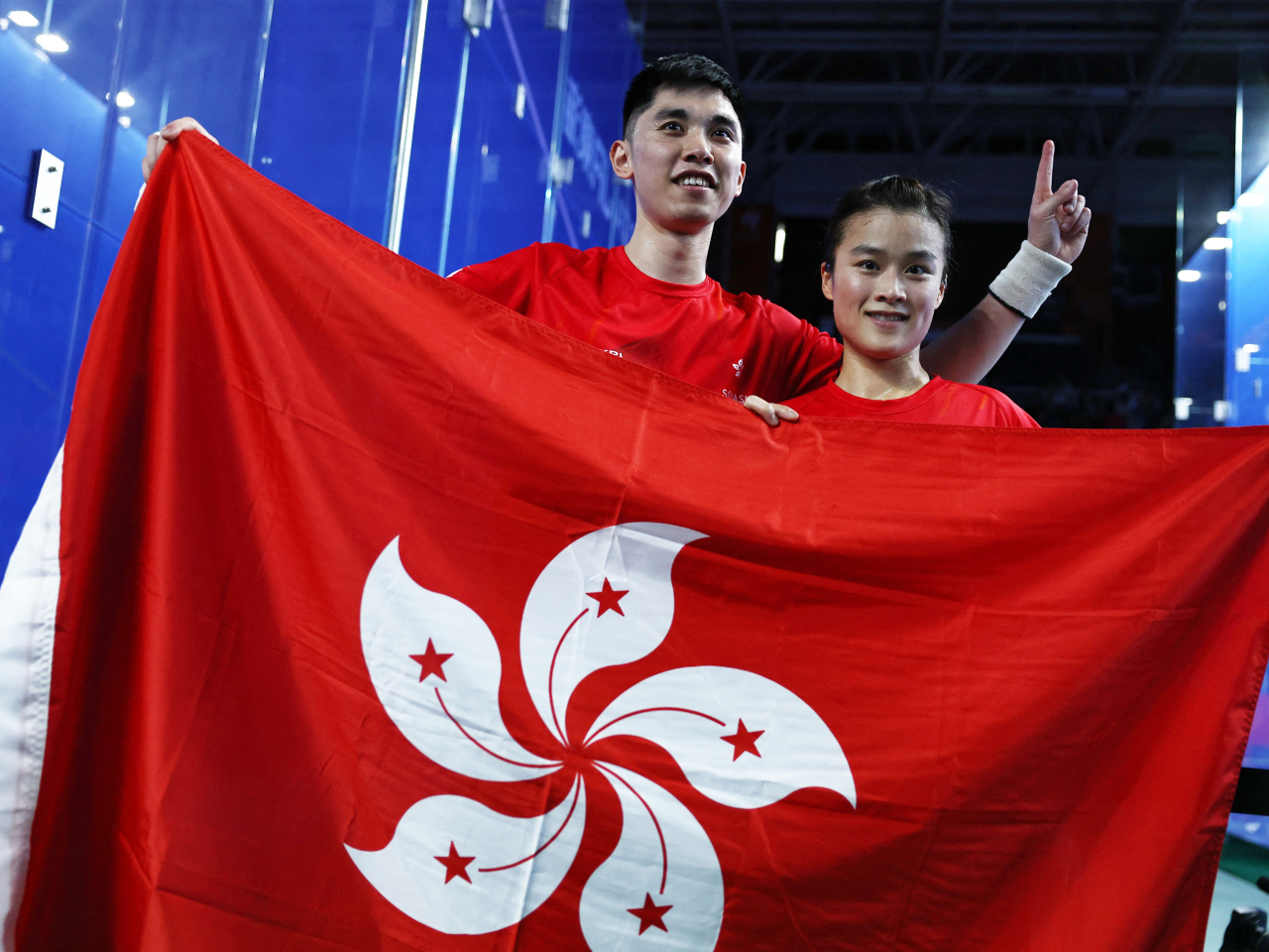 Tang Ming-hong, left, and Lee Ka-yi reign supreme in squash mixed doubles in Nagoya. Photo: Reuters