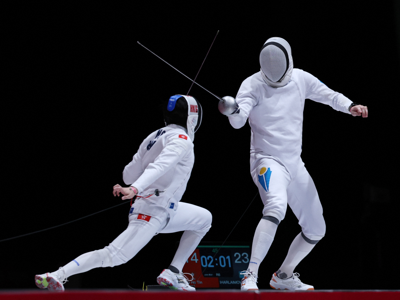 Ng Ho-tin of Hong Kong, China, left, in semifinal action against Kazakhstan's Vadim Sharlaimov. Photo: Reuters