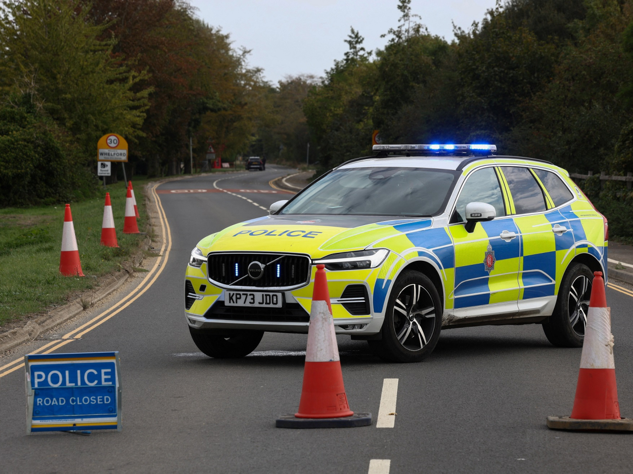 British police block a road near the RAF Fairford after officers declare a major incident there. Photo: Reuters
