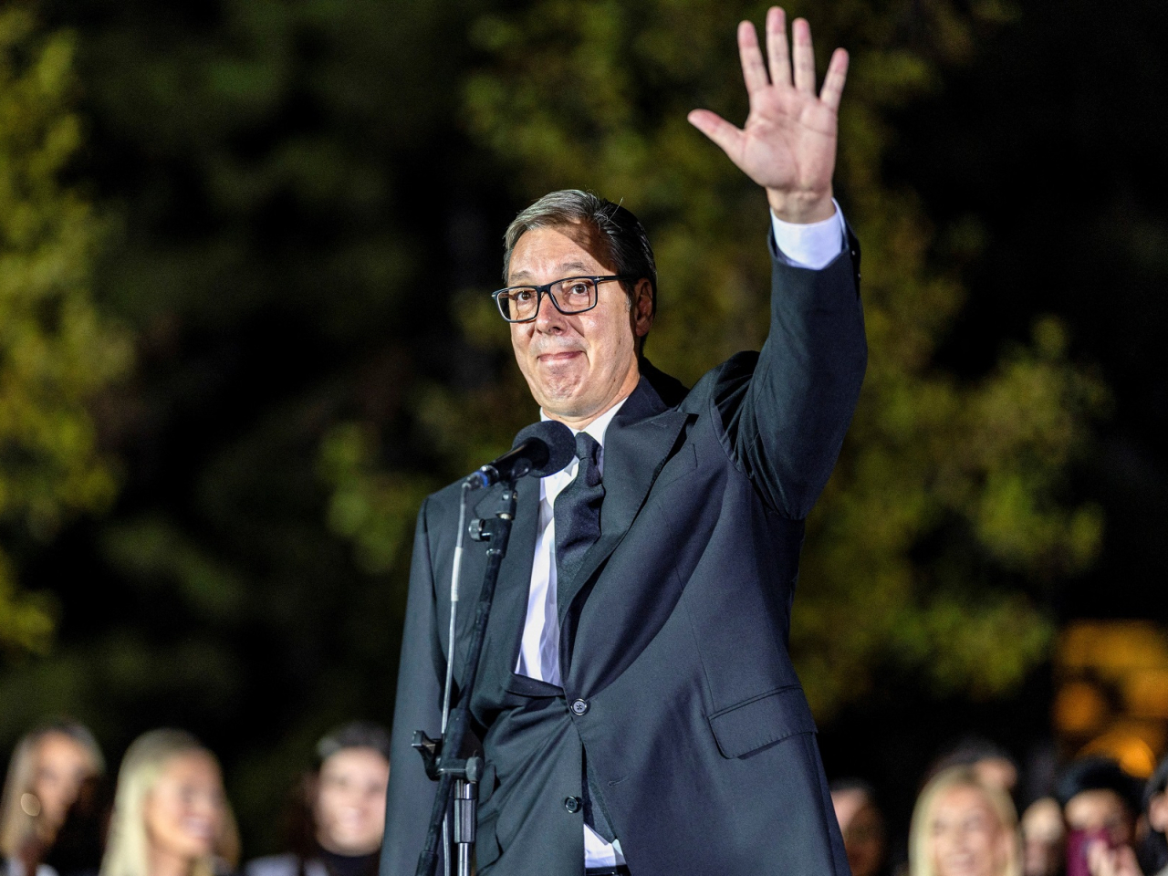 Serbian President Aleksandar Vucic waves outside the Presidency of Serbia in Belgrade moments before formally submitting his resignation. Photo: Reuters
