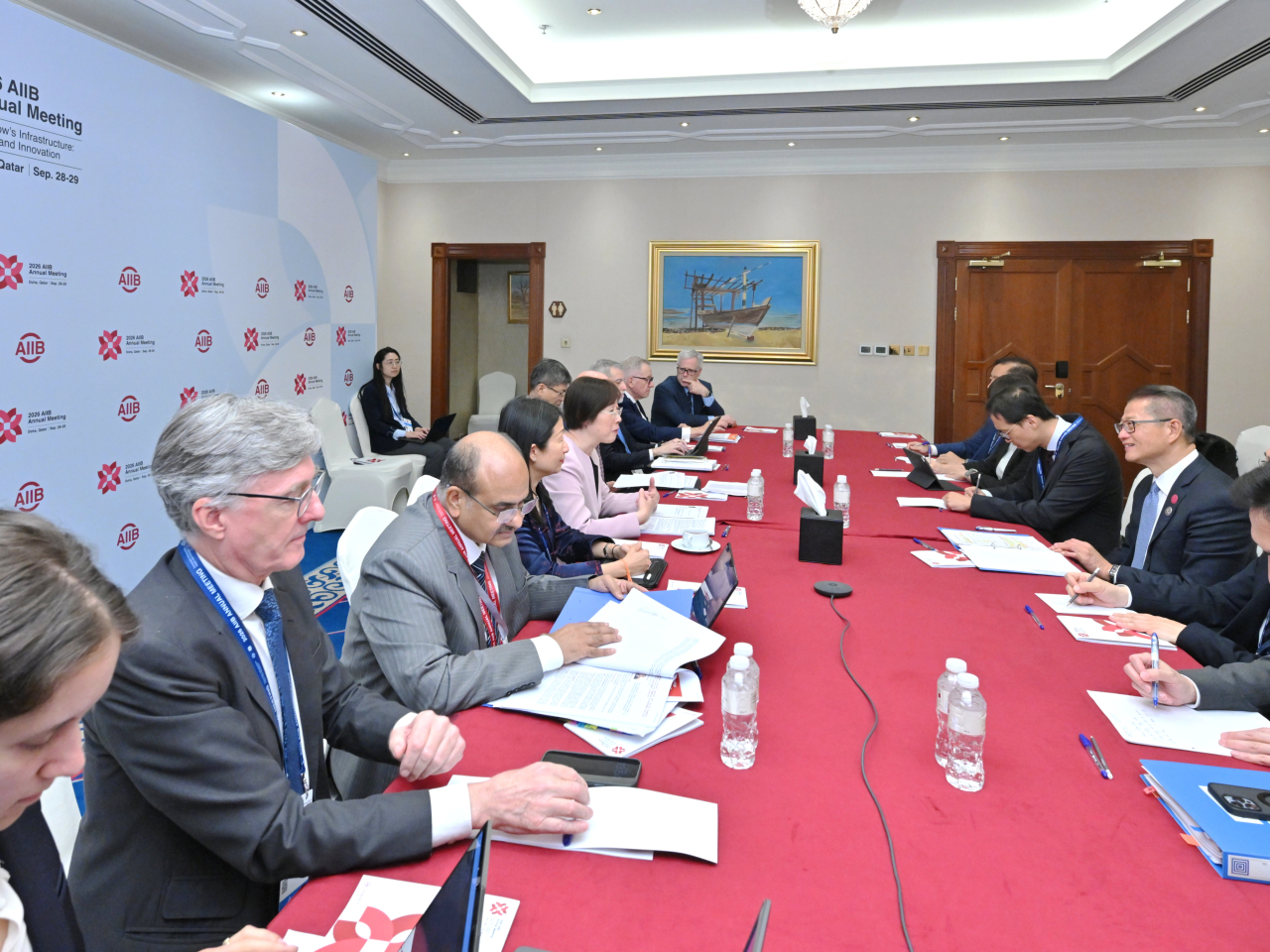 Paul Chan (third right) meeting with the President and Chair of the Board of Directors of the AIIB, Zou Jiayi (fifth left). Photo courtesy of the Information Services Department