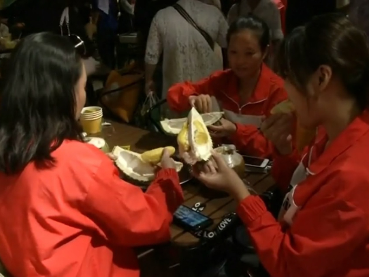 Chinese tourists dig into Malaysian durian. File photo: Reuters
