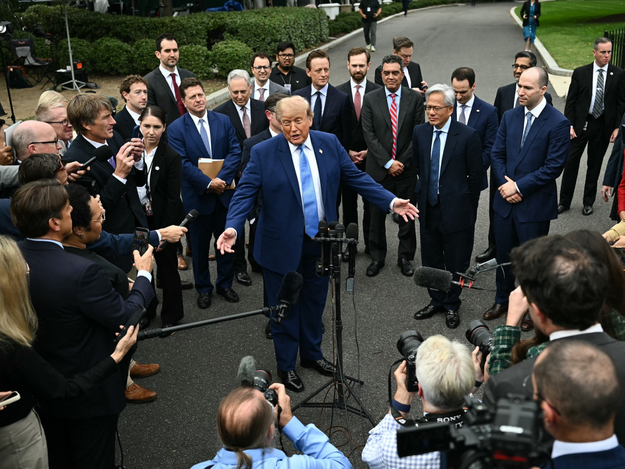 US President Donald Trump said top tech executives have agreed to set voluntary standards for AI that were "morally binding". Photo: AFP