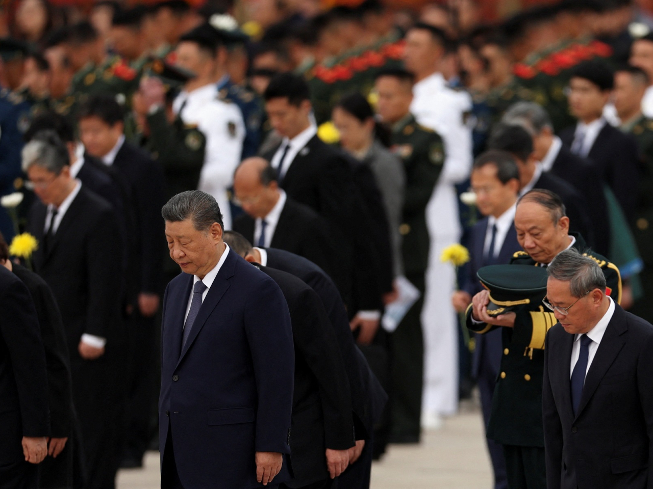 President Xi Jinping, Premier Li Qiang and other senior party and state leaders pay silent tribute during a ceremony to mark Martyrs' Day in Tiananmen Square in Beijing. Photo: Reuters