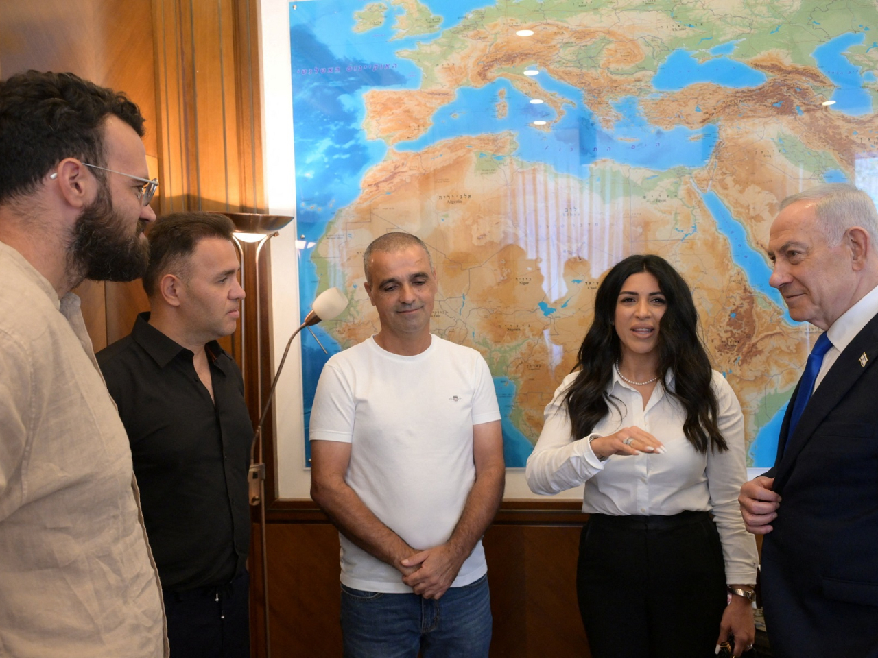 Israeli Prime Minister Benjamin Netanyahu meets passengers who intervened on a flydubai flight bound to Israel from the United Arab Emirates, in Jerusalem. Photo: handout via Reuters