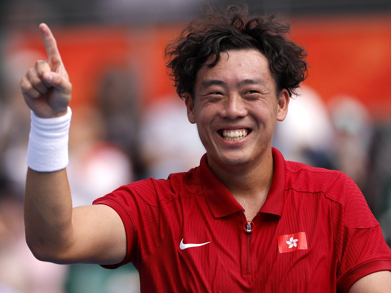 Coleman Wong is all smiles after beating Wu Yibing 6-2, 6-4 in the Asian Games men's singles final in Nagoya. Photo: Reuters