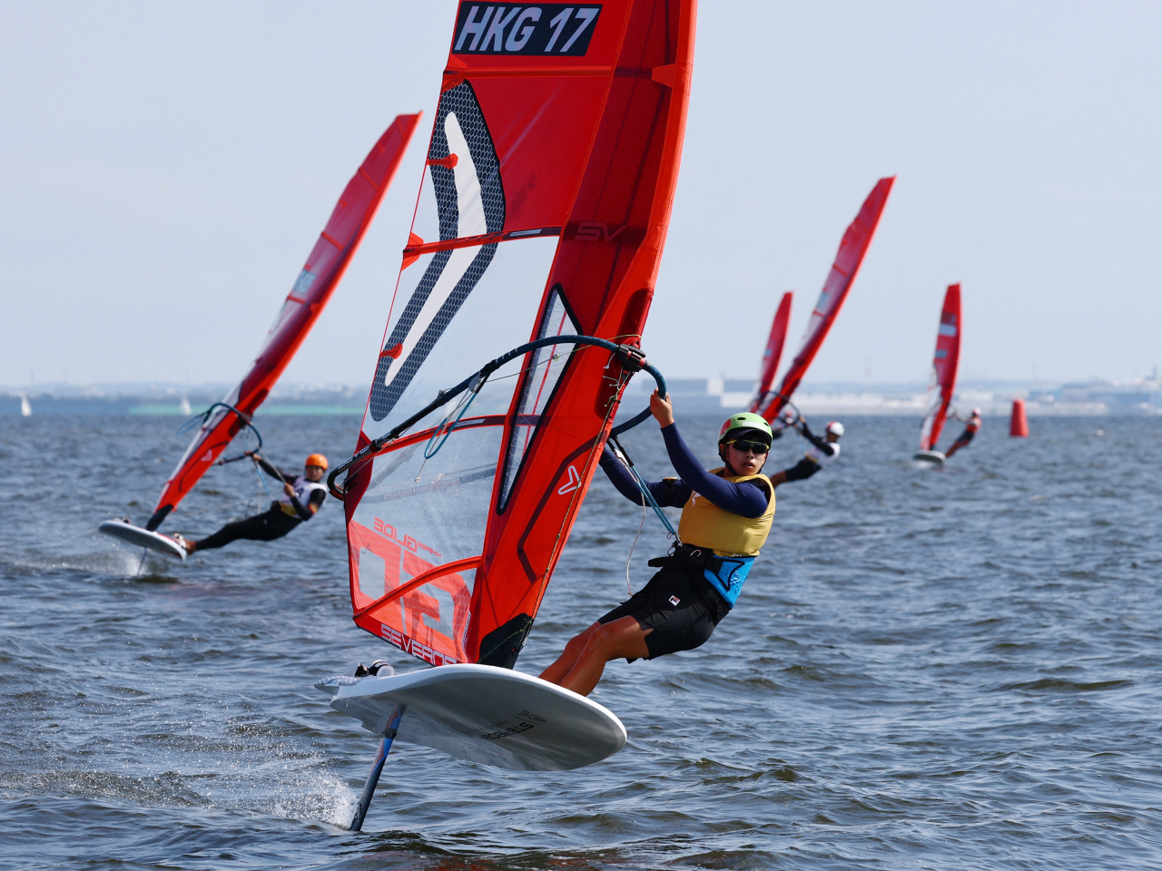 Wong Tsz-ho clinches gold in the boys' iQFoil windsurfing event with 13 net points. Photo: Reuters