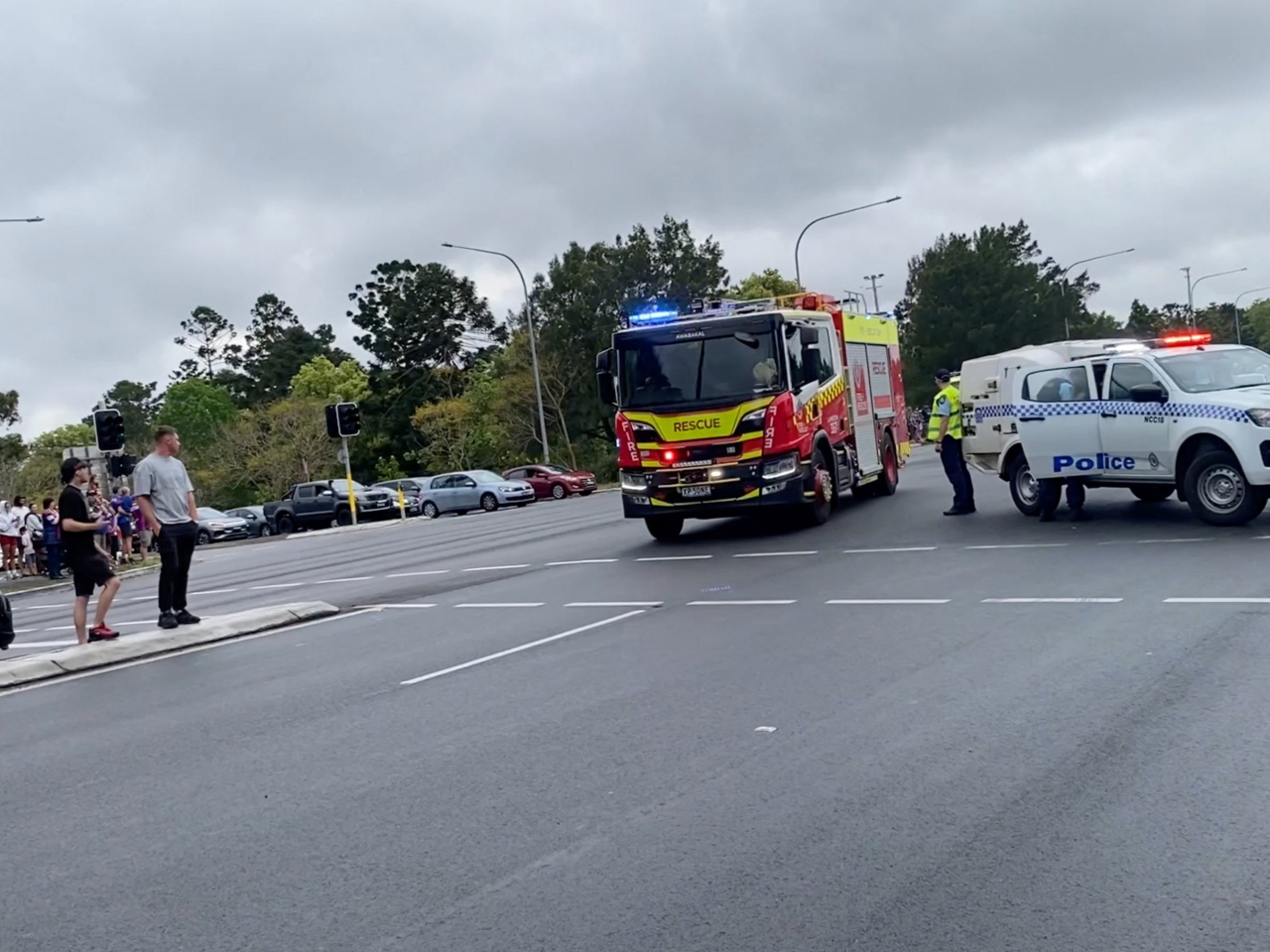 An emergency vehicle races towards the accident scene in Newcastle, New South Wales. Photo: Kai Preston via Reuters