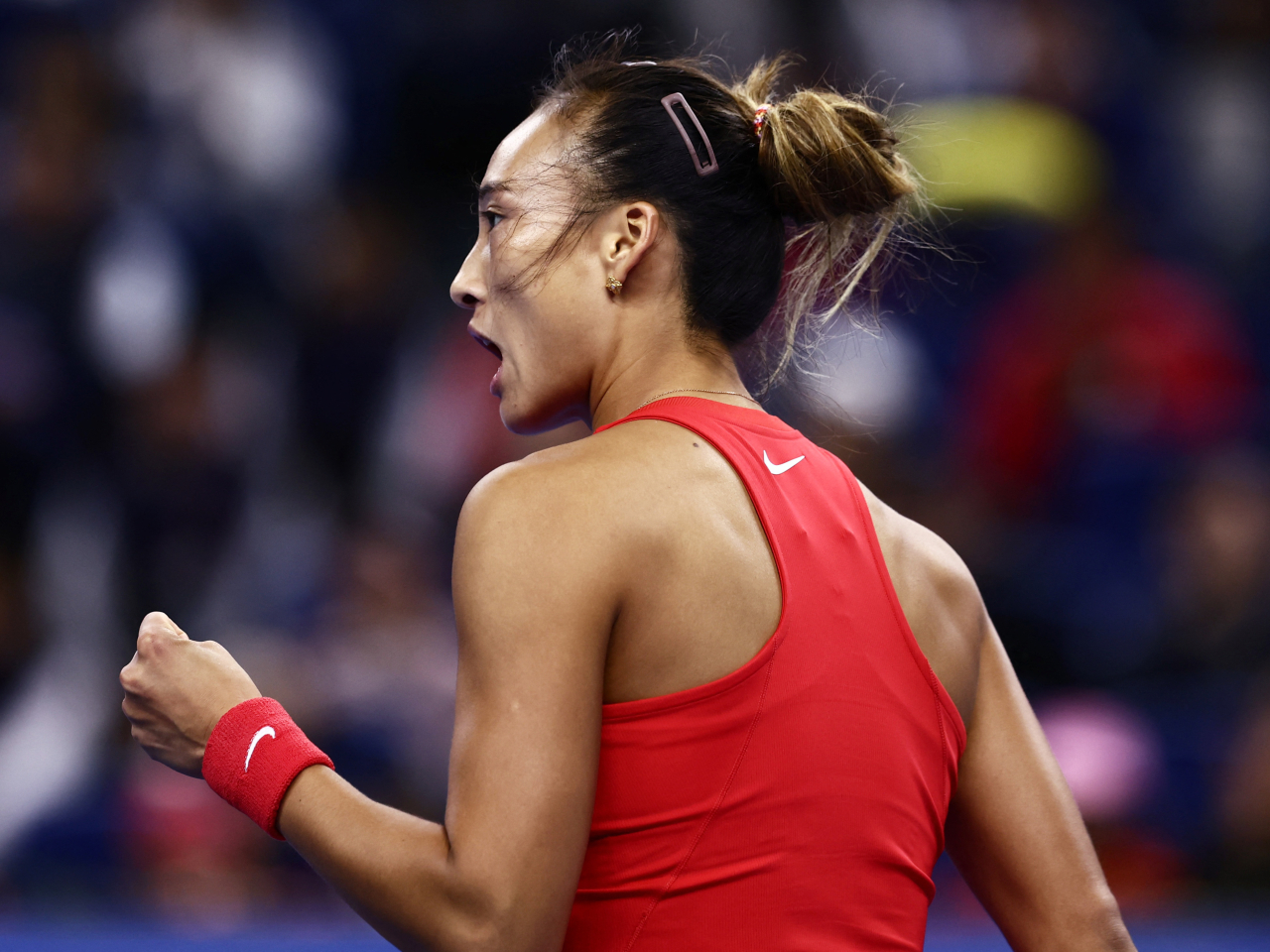 Zheng Qinwen celebrates winning set 2 of her round of 64 match against Russia's Anna Kalinskaya, in Beijing. Photo: Reuters