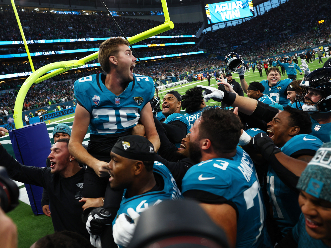 Jacksonville's Cam Little celebrates with teammates after his game-winning field goal. Photo: Reuters