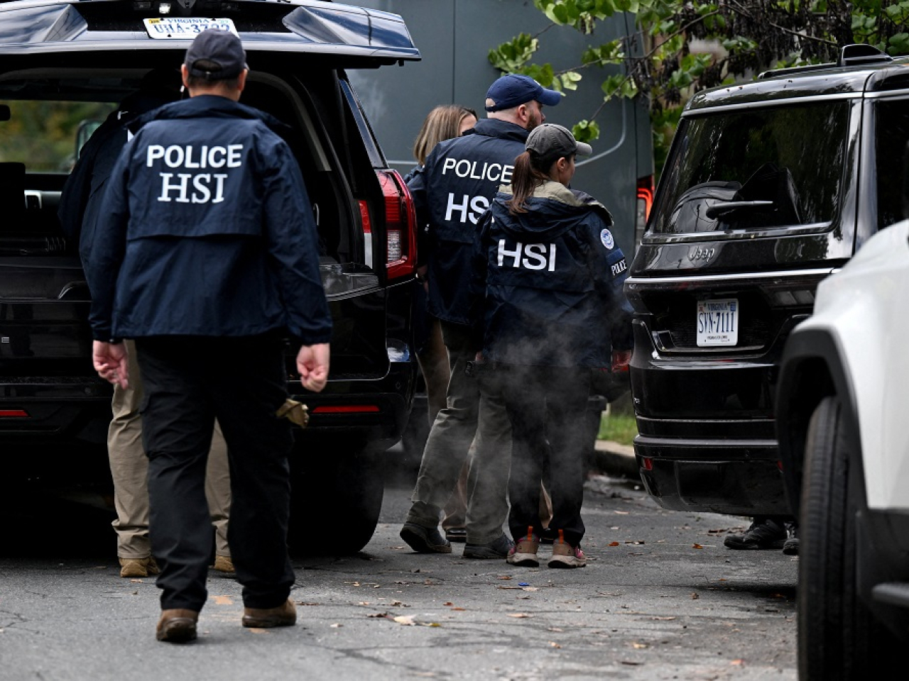 Agents from Homeland Security Investigations swarm the house of Ilhan Omar, a leftist Democrat and fierce critic of Donald Trump. Photo: Reuters