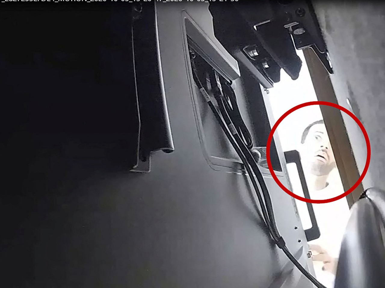 The US Justice Department released a photo purporting to show Abdulrahman Alfozan checking a hidden audio recording device in an OpenAI conference room. Photo: handout via Reuters