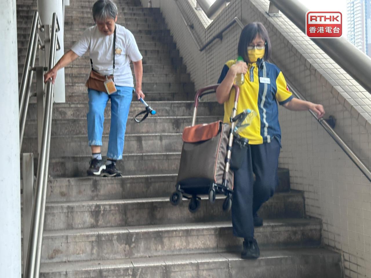 Commuters have to walk down a long staircase to get to the outdoor shuttle bus stop. Photo: RTHK