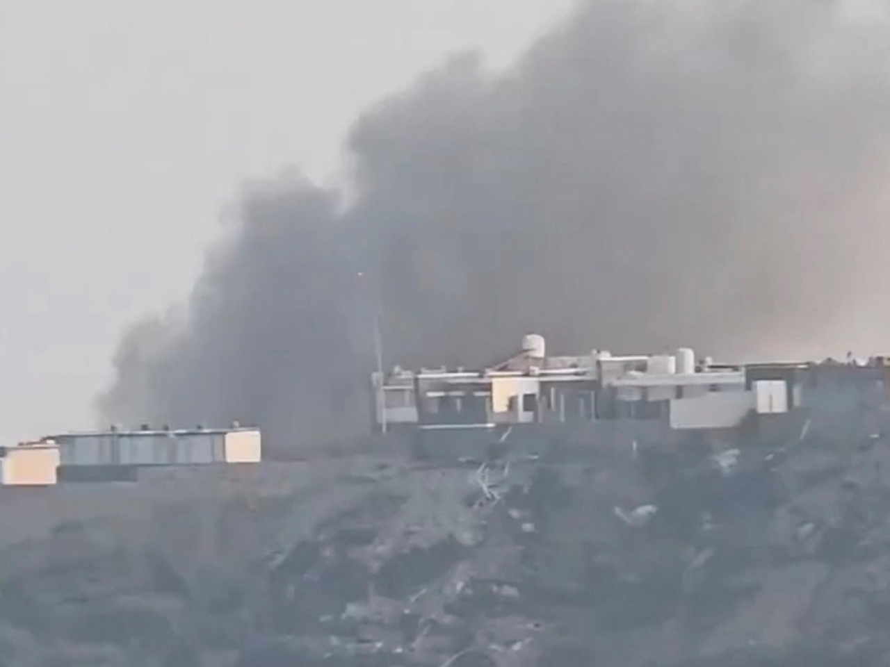Smoke billows from the presidential palace complex in Yemen following an attack by Houthi rebels. Screengrab: social media via Reuters
