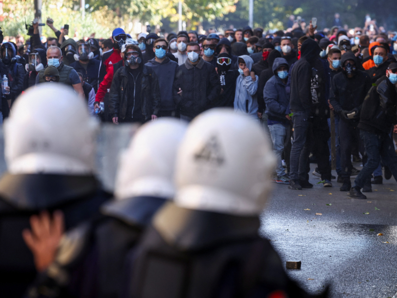 Protesters face off riot police officers holding a line amid an anti-government protest by the youth in Tirana, Albania. Photo: Reuters