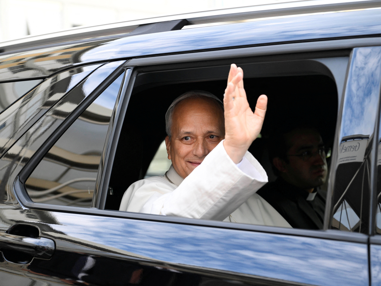 Pope Leo waves as he leaves Gemelli Hospital following his lung surgery and cancer diagnosis in Rome, Italy. Photo: Reuters