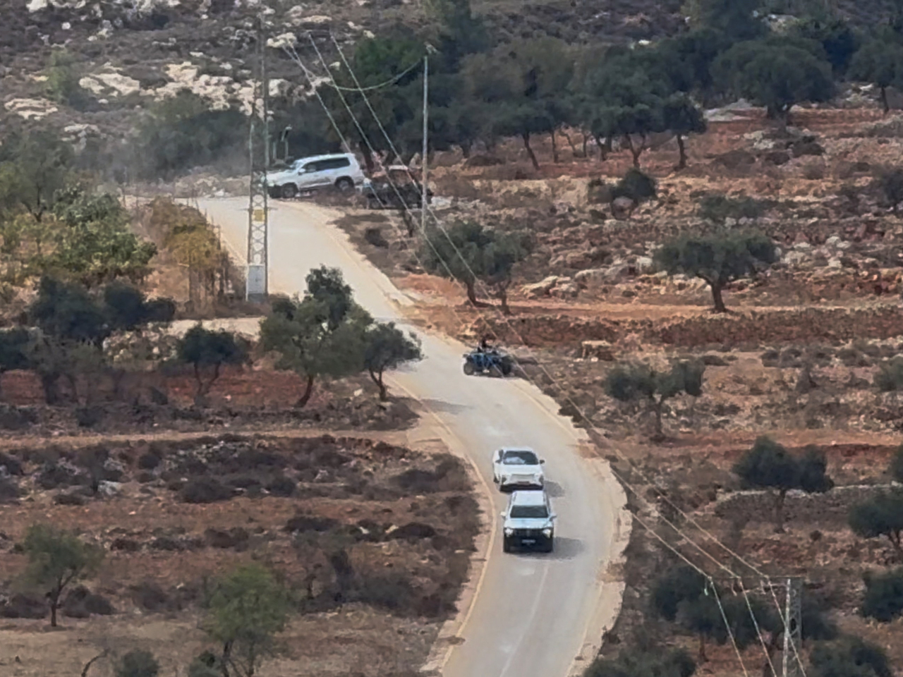 Vehicles drive at the site where Belgium's foreign minister says masked settlers in the Israeli-occupied West Bank attacked Palestinians. Photo: Reuters