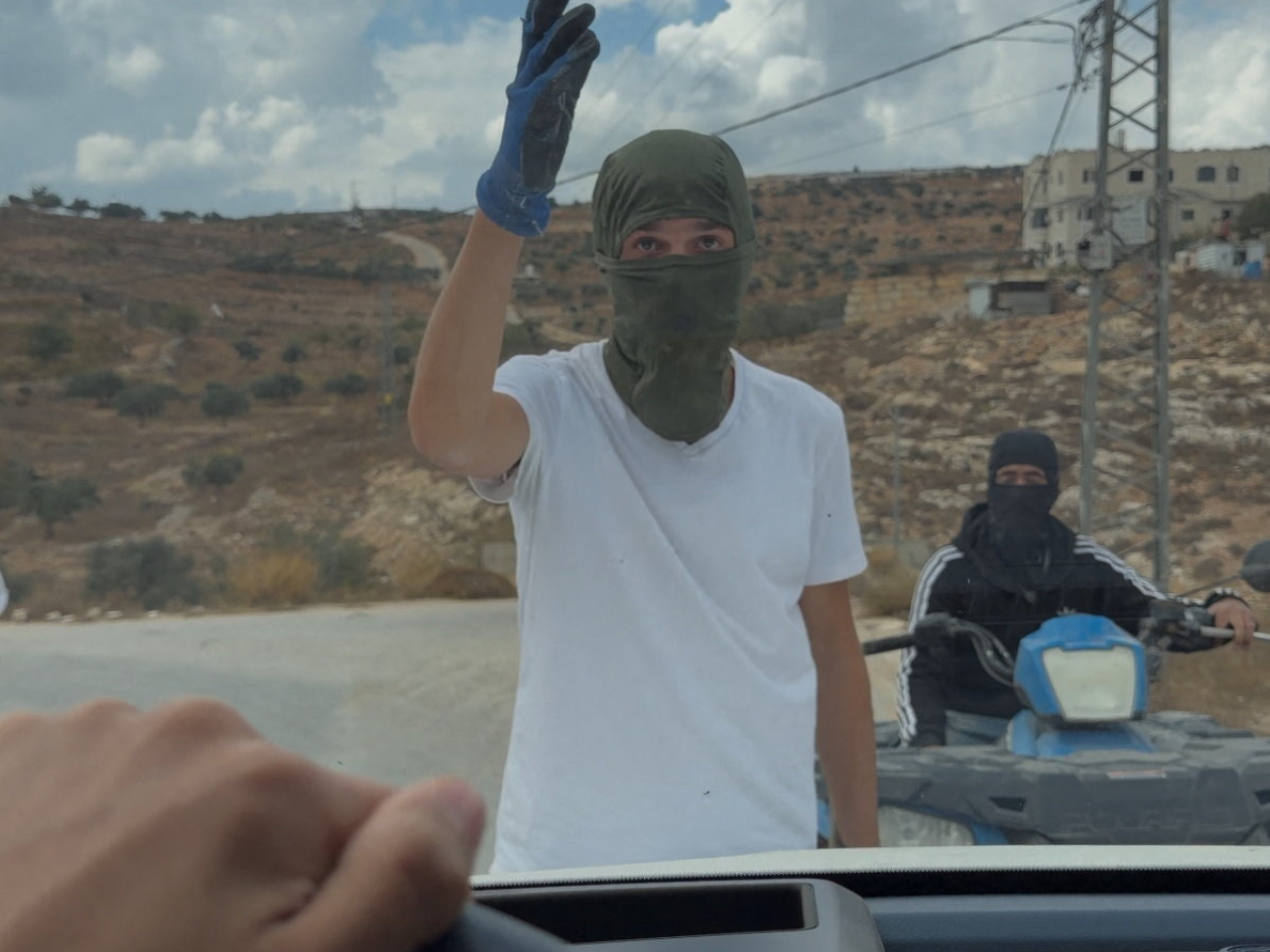 Masked settlers are accused of attacking Palestinians, Catholic representatives and Western diplomats and officials in Taybeh in the occupied West Bank. Screengrab: Amit Orfali via Reuters