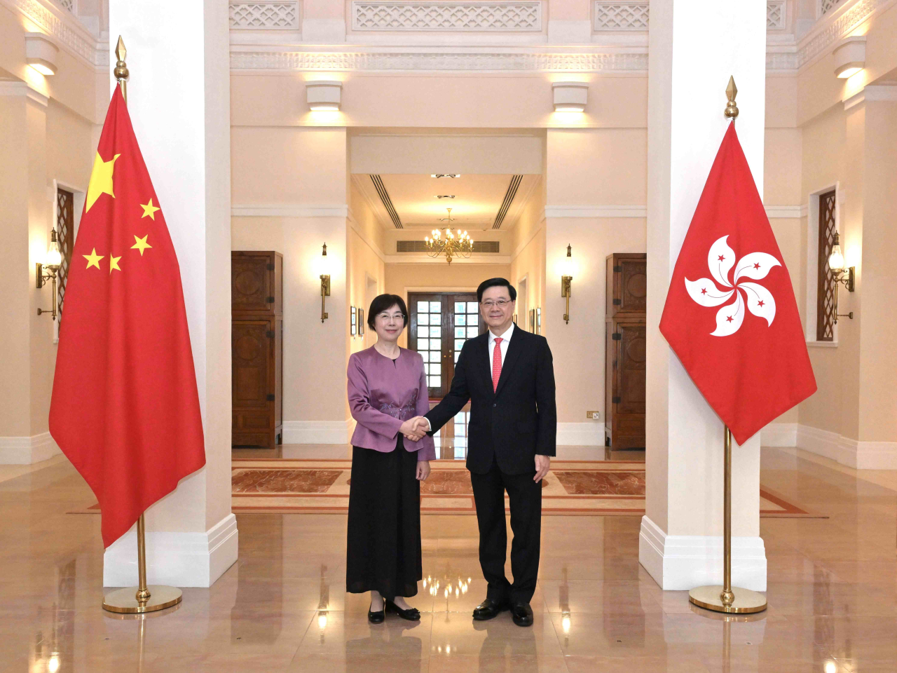 John Lee meets AIIB President Zou Jiayi at Government House. Photo courtesy of Information Services Dept