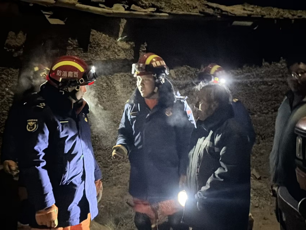 Fire services personnel are helping with the rescue work after a 7.0 magnitude quake struck Baqen County on Thursday evening. Photo: Xinhua