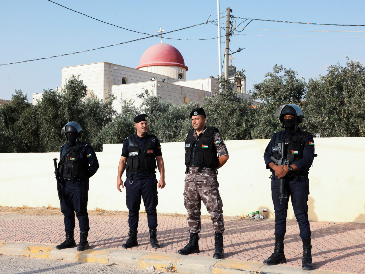 Jordanian security personnel put on a show of force outside the Karak church where the massacre took place. Photo: Reuters