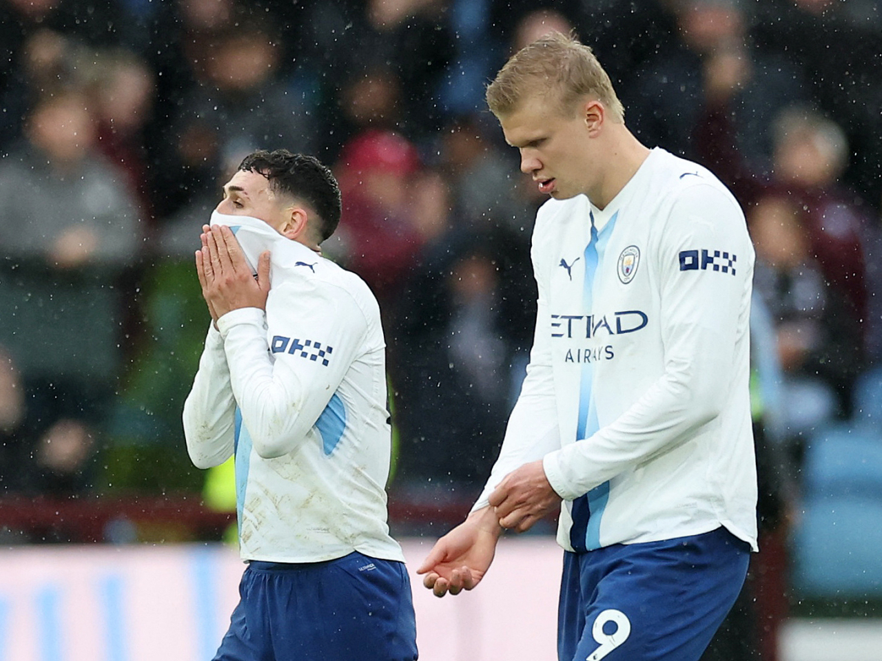 Manchester City's Phil Foden and Erling Haaland walk off the field after their side's defeat. Photo: Reuters