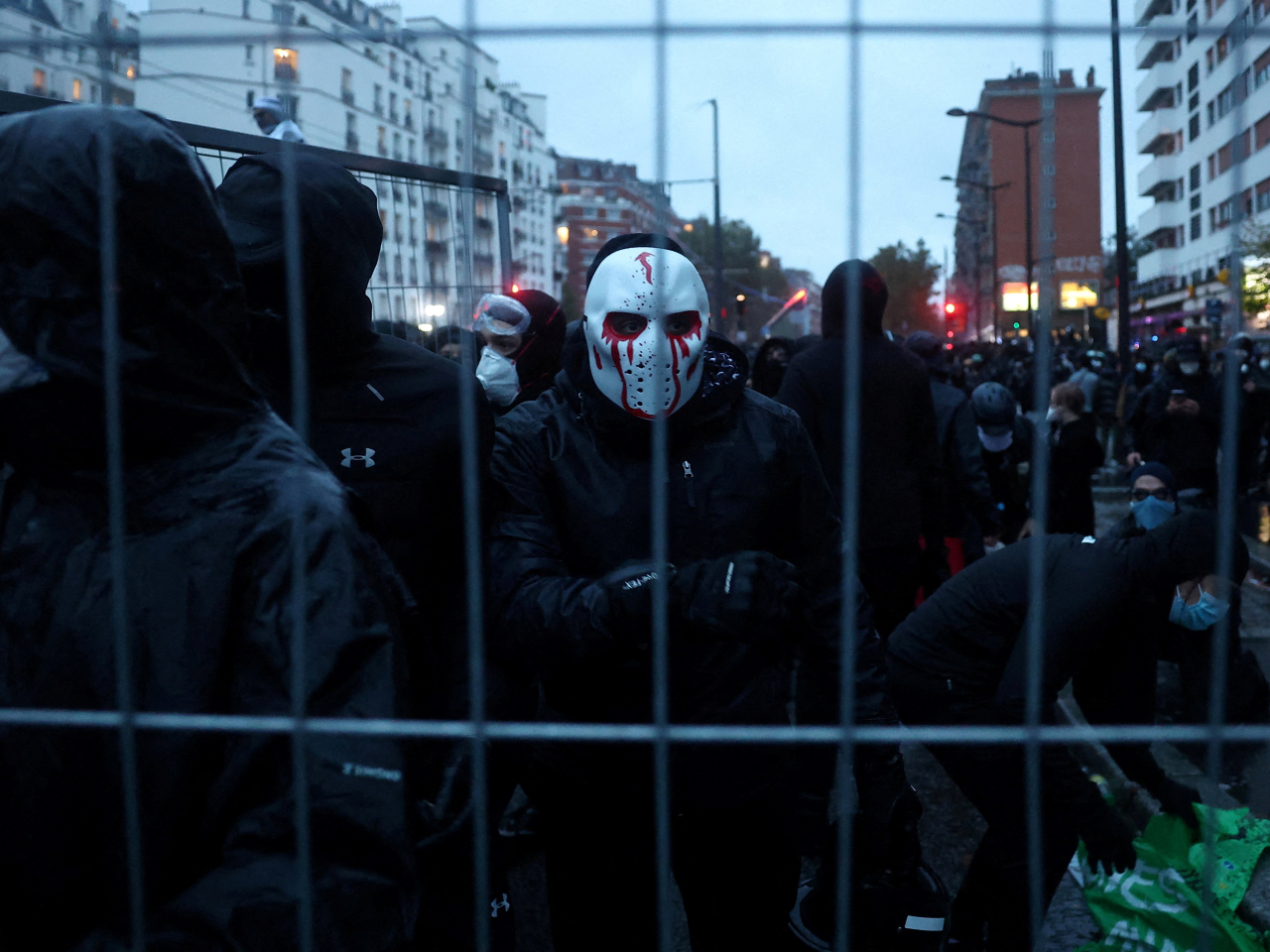 Masked protesters install a barricade during a demonstration as part of nationwide protests against the cost of living and rising fuel prices. Photo: Reuters