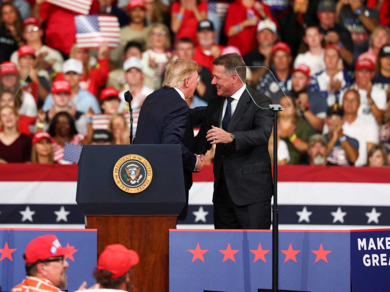 Donald Trump was joined on stage by Gernot Dollner, the chairman of the board of management at Audi. Photo: Reuters