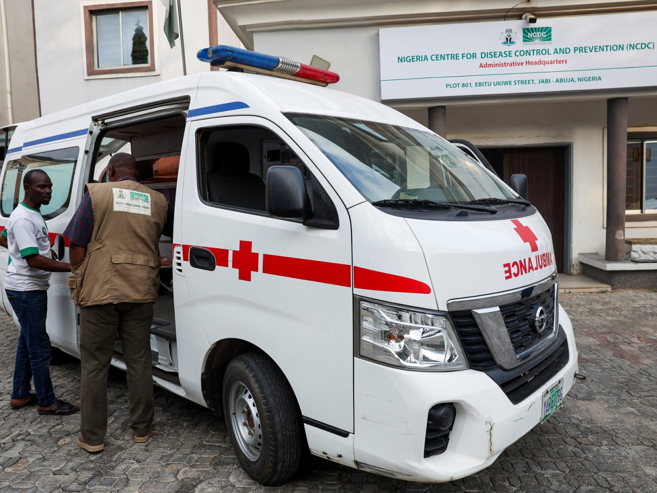 Health workers at the Nigeria Centre for Disease Control and Prevention prepare an ambulance for a suspected Ebola case in Abuja. Photo: Reuters