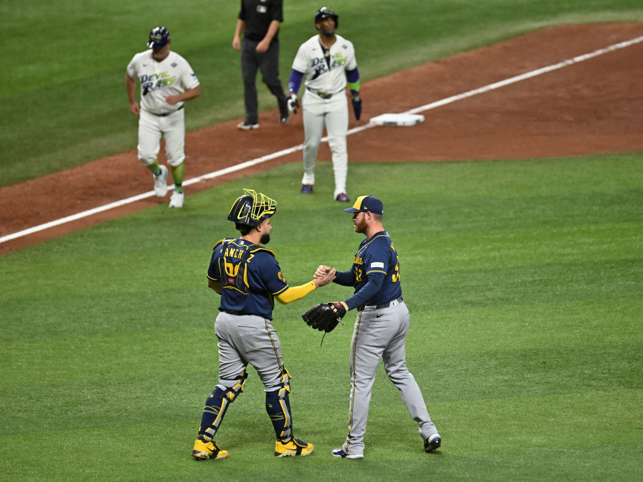 Milwaukee Brewers pitcher Brandon Woodruff celebrates with catcher Gary Sanchez after the last out of the game against Tampa in game three of the World Series. Photo: Reuters