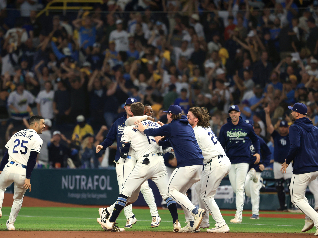 Tampa Bay Rays pinch hitter Ben Williamson celebrates with teammates after a walk-off single against the Brewers helped them remain in the World Series. Photo: Reuters