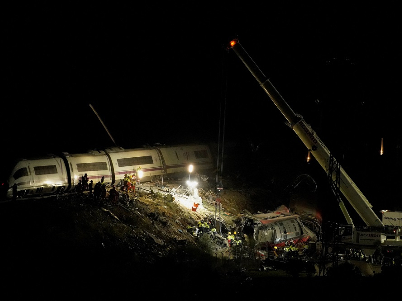 Emergency services hunt for possible survivors after Spain's second train disaster this year. Photo: Reuters